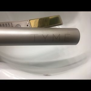 TYME flat / curling iron. Adjustable heat.